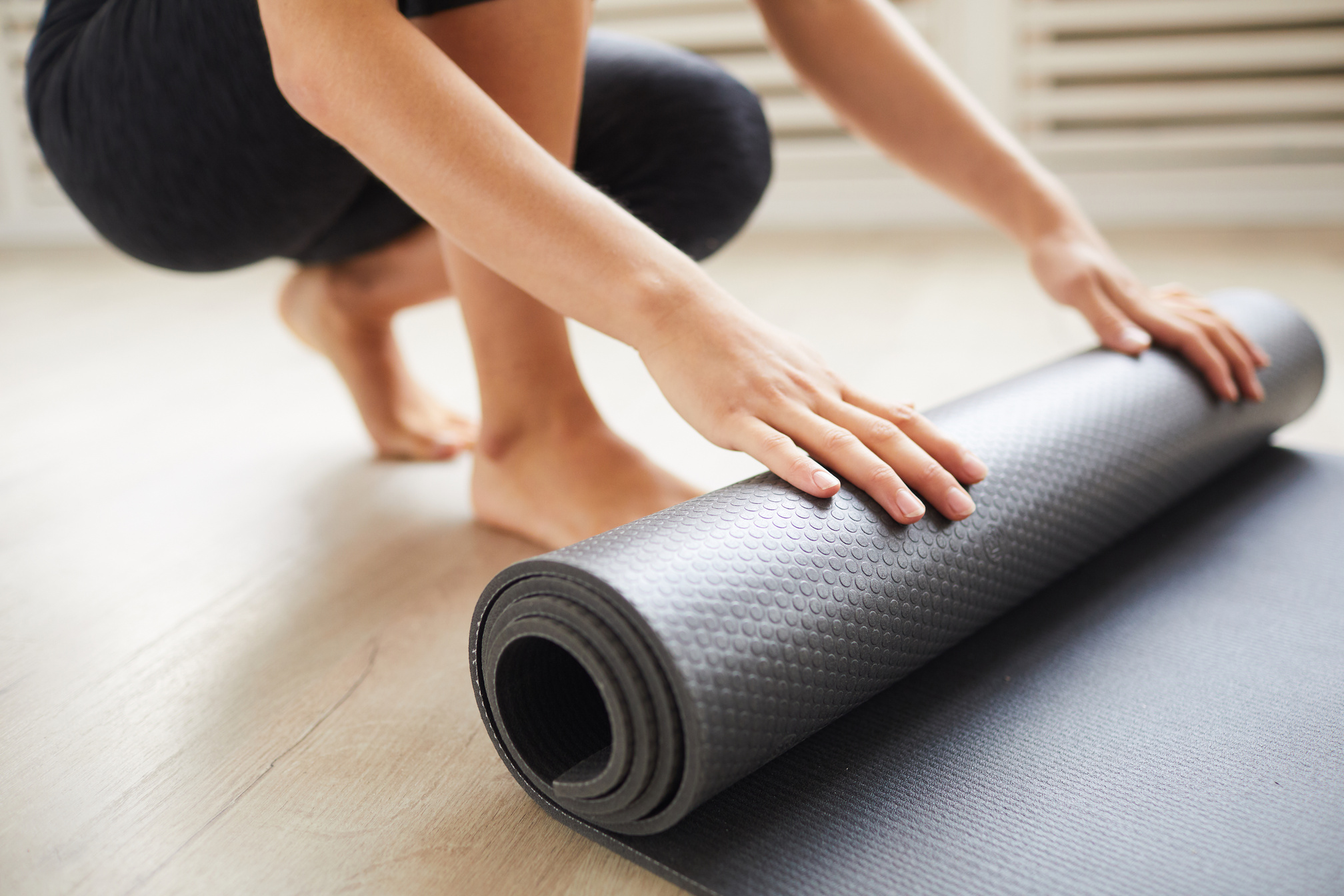 Woman with Exercise Mat